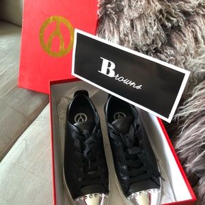 Black “Wishbone” flats with silver accent .